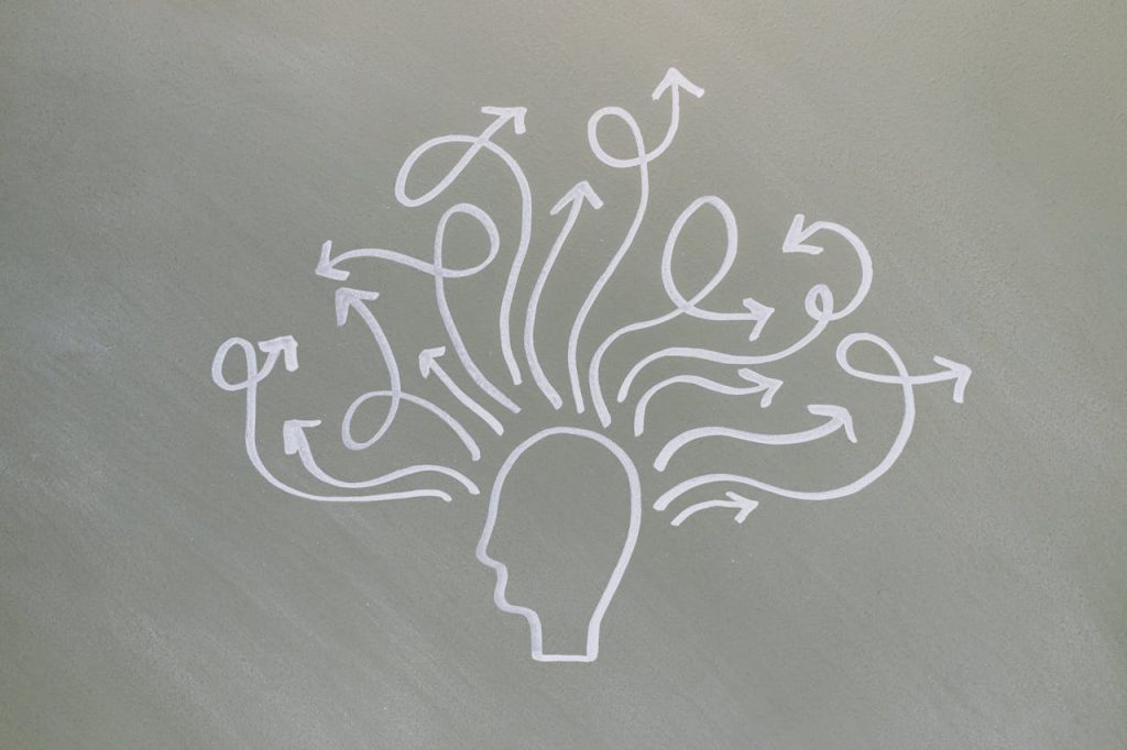 mental-health-related-conceptual-art-8378723 Conceptual chalk drawing illustrating mental health challenges with arrows representing thoughts.